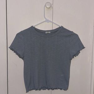 Grey-blue ruffled top. Not cropped. Size small.
